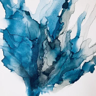 Teal alcohol ink spreads like branching seaweed across white paper, every wash edged with darker pigment lines, the right margin left almost bare.
