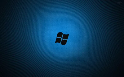 The window mark sits cut out in black on a textured blue field with a soft glow spreading behind it.