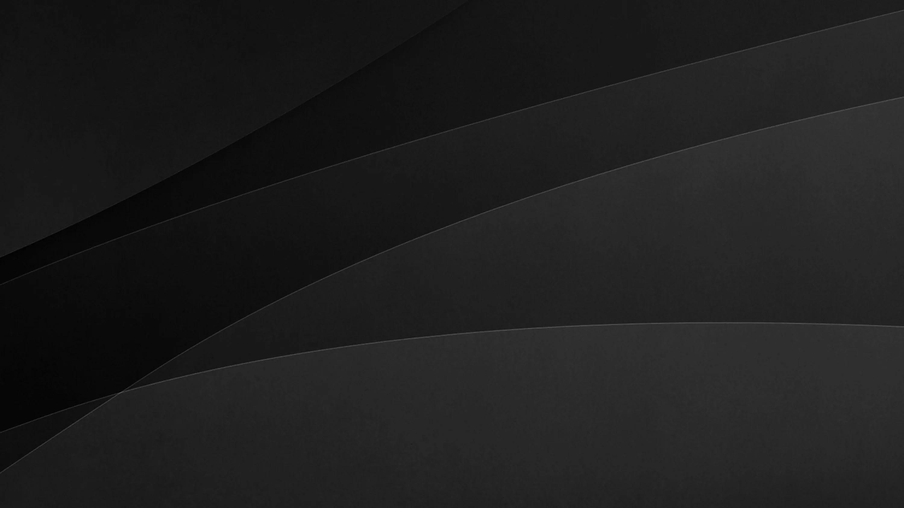 Two long curved panels sweep across a charcoal background, separated by nothing more than a slight shift in tone.