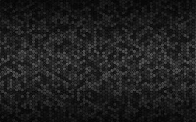 Thousands of small hexagons tile the surface in shifting greys, brightest through the middle and darker at the corners.