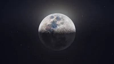 A sharp astrophotography stack of the waning gibbous moon, craters crisp inside a soft halo, with flat near-black space on every side for icons.