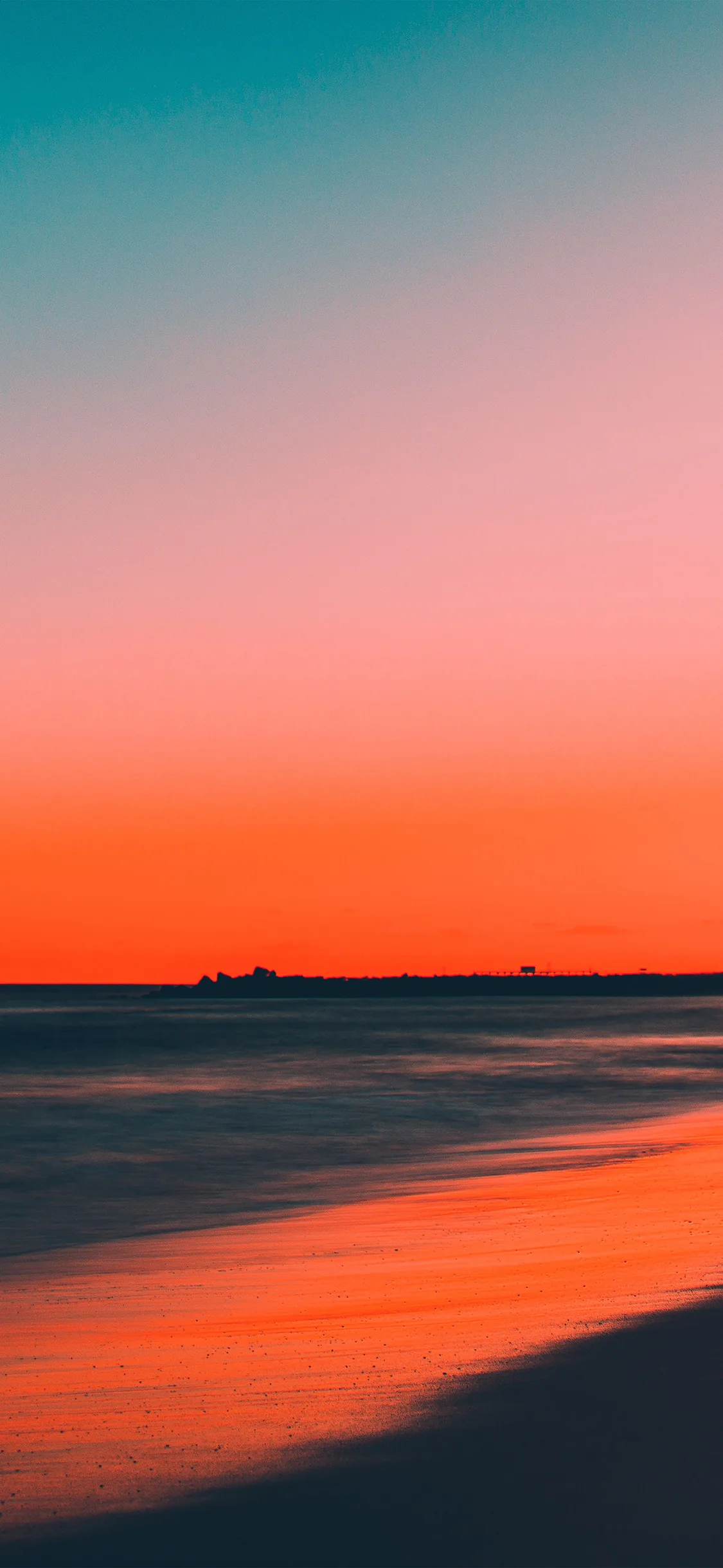 A clean gradient runs from teal at the top through coral to a dark sea, the upper half nearly empty — plenty of room for a clock or widgets.