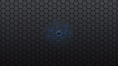 A dark honeycomb grid runs edge to edge with a small cluster of cells glowing blue near the centre.