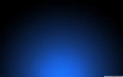 A soft blue light rises from the bottom edge and falls away to near-black at the top, the whole surface carrying a fine dot texture.