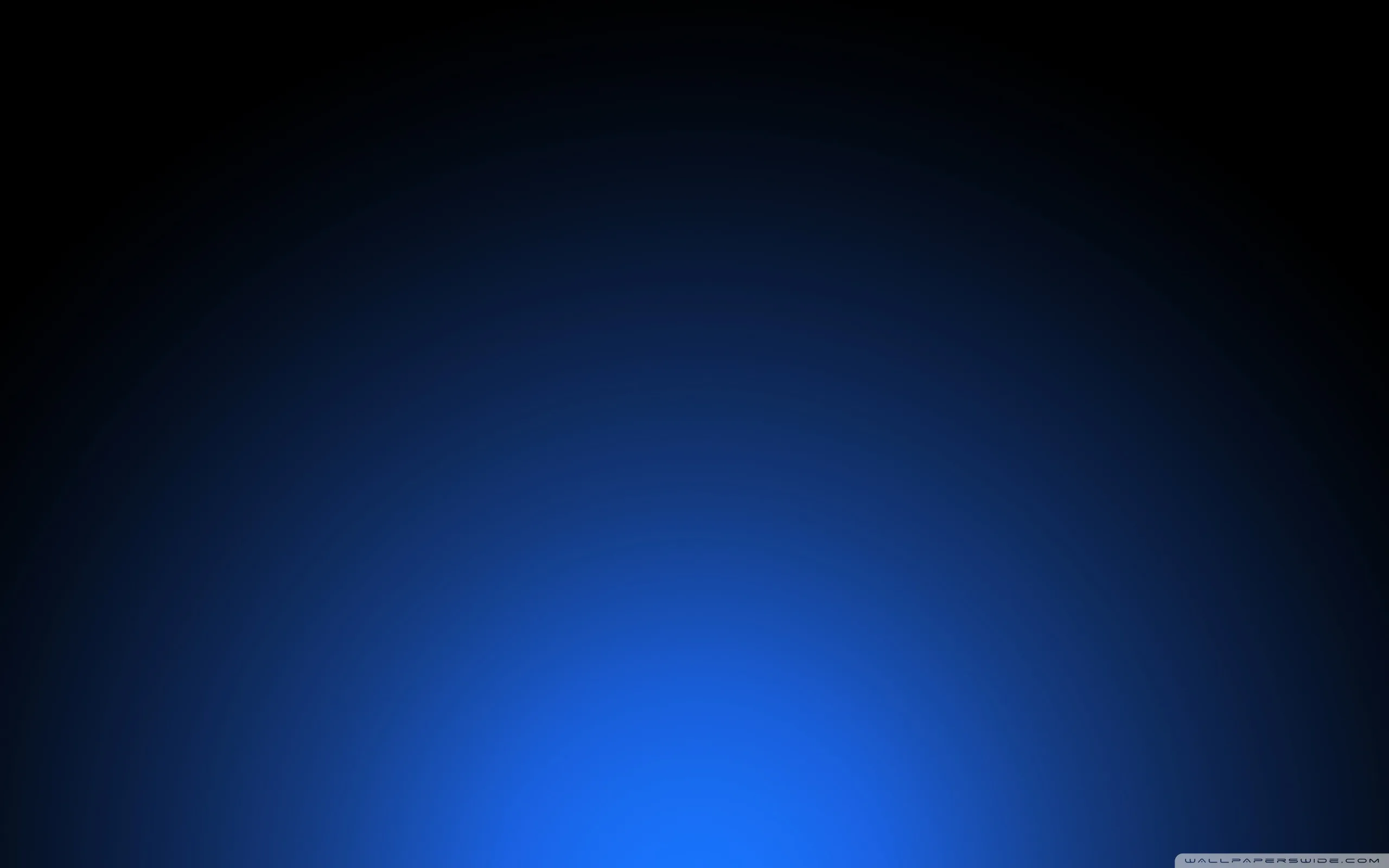A soft blue light rises from the bottom edge and falls away to near-black at the top, the whole surface carrying a fine dot texture.