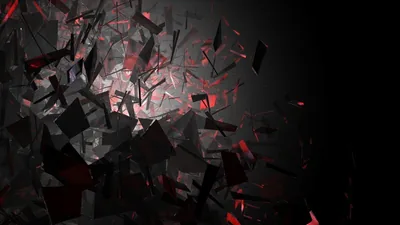 Dark fragments blow outward from the centre, red light catching the edges of the pieces as they scatter.