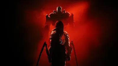 A fighter with extended mantis blades stands before a hulking machine, the whole scene washed in red with both lower corners fading to black.