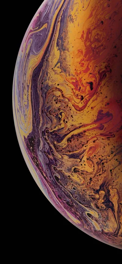 Molten swirls of gold, orange and violet curl across the planet's face in the fluid iPhone XS style, a black sliver kept along the right edge.