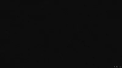 A single unbroken black field with no texture or gradient anywhere in the frame — true #000000 that keeps OLED pixels switched off.
