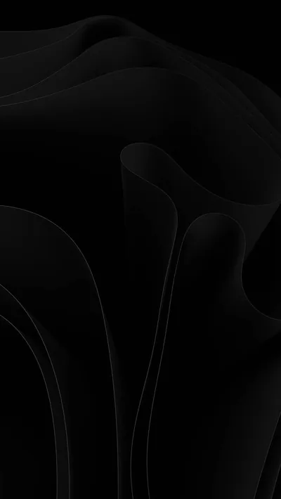 Smooth sheets of near-black cloth fold and overlap in soft waves, the top left corner left empty and flat for icons.