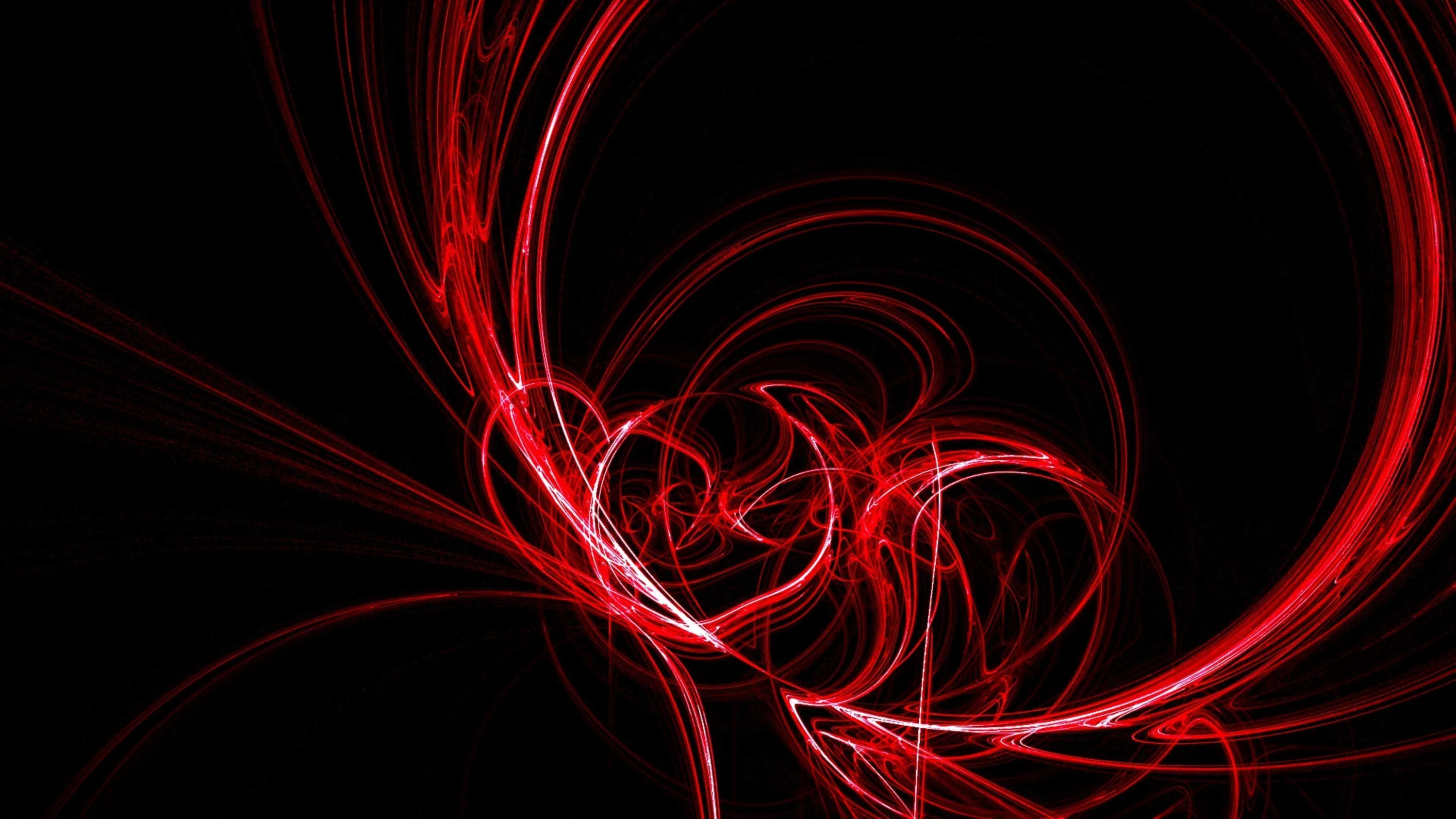 Thin red light trails coil into a spiral left of centre, the rest of the frame left in flat black.
