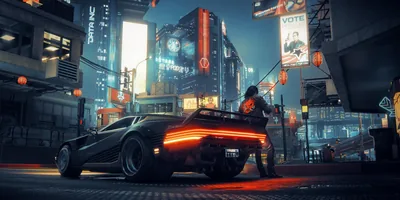 A merc leans against a low black coupe whose tail-light strip burns orange, election posters and tower screens lighting the junction behind him.