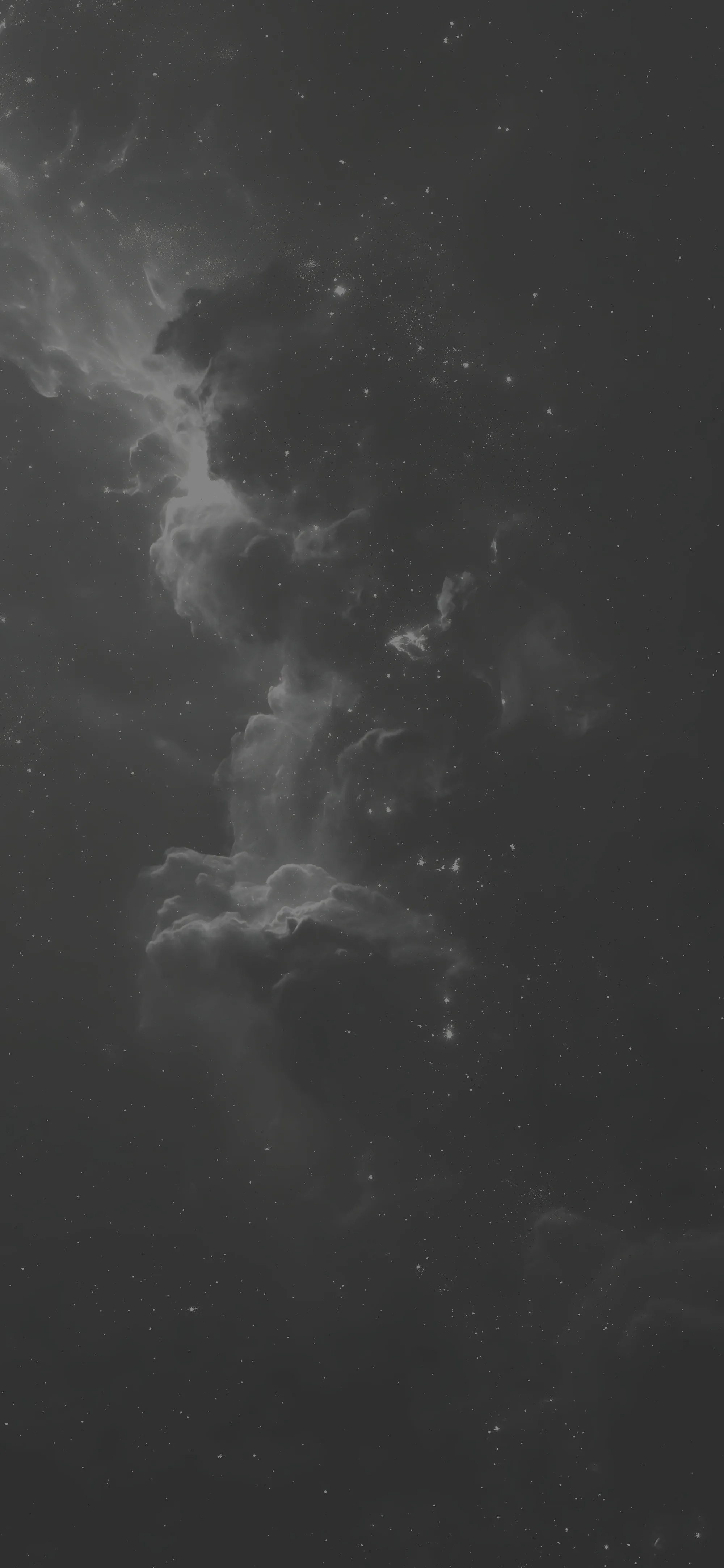 Soft grey nebula clouds drift down a tall narrow frame in low contrast, only a scatter of small stars breaking the grain.