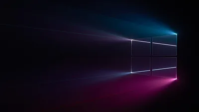 The four-pane outline sits right of centre with teal light spilling from the top corner and magenta pooling below it, thin beams stretching away to the left.