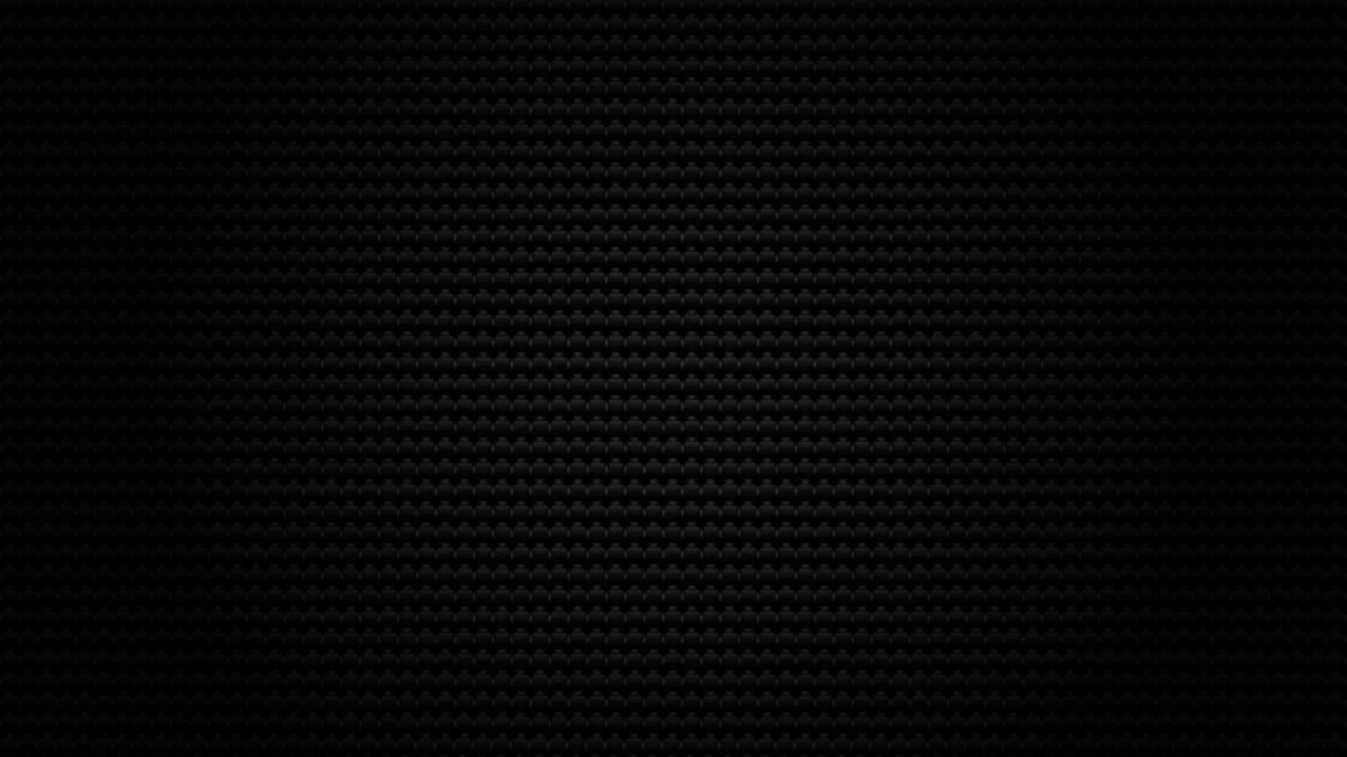 A tight diagonal carbon weave covers the frame, catching a dim light from the upper left so the pattern reads only in the highlights.
