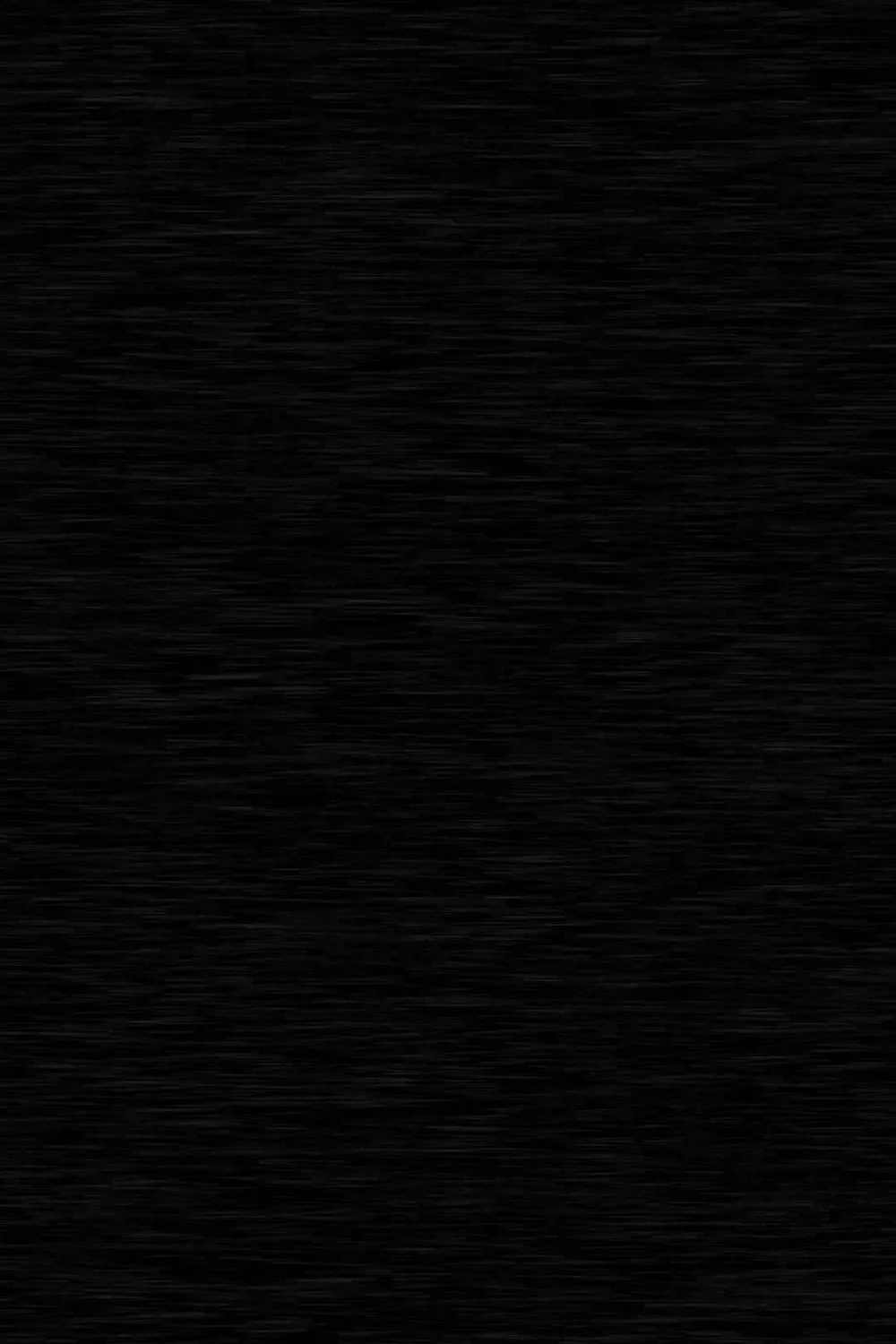 Horizontal grain lines run edge to edge across near-black wood, visible only as faint scratches of lighter tone.