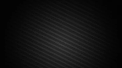 Soft grey stripes slant across the frame and fade into black at the left edge, leaving that side clear for desktop icons.