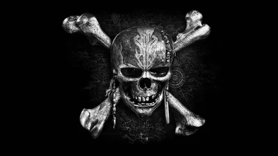 A pirate skull in a knotted bandana sits above crossed bones, its stone texture picked out in grey against a black field.