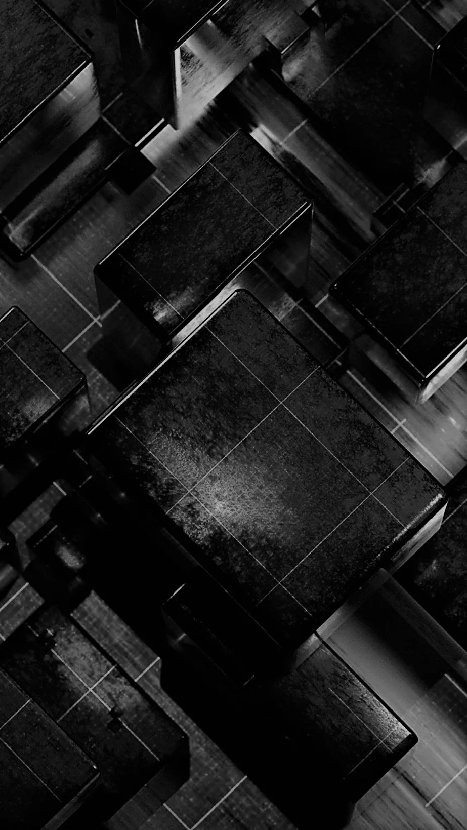 Rough concrete-textured cubes pile diagonally across the frame, edges picked out in thin grey where the light clips them.