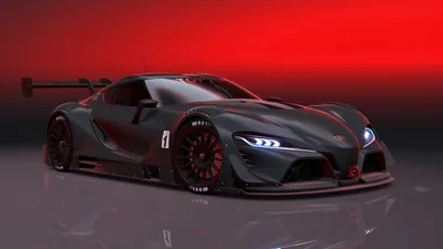 A dark grey track prototype with a tall rear wing and huge front splitter, shot in three-quarter view against a deep red graduated wall.