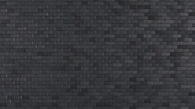 Neat rows of narrow charcoal brick tiles in a running bond, evenly lit so the pattern stays crisp corner to corner.