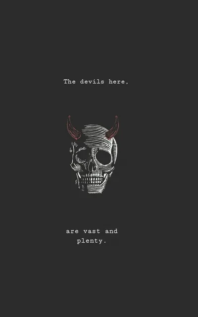 A finely etched skull with small horns floats mid-frame on charcoal grey, typewriter lettering spaced above and below it with room to breathe.