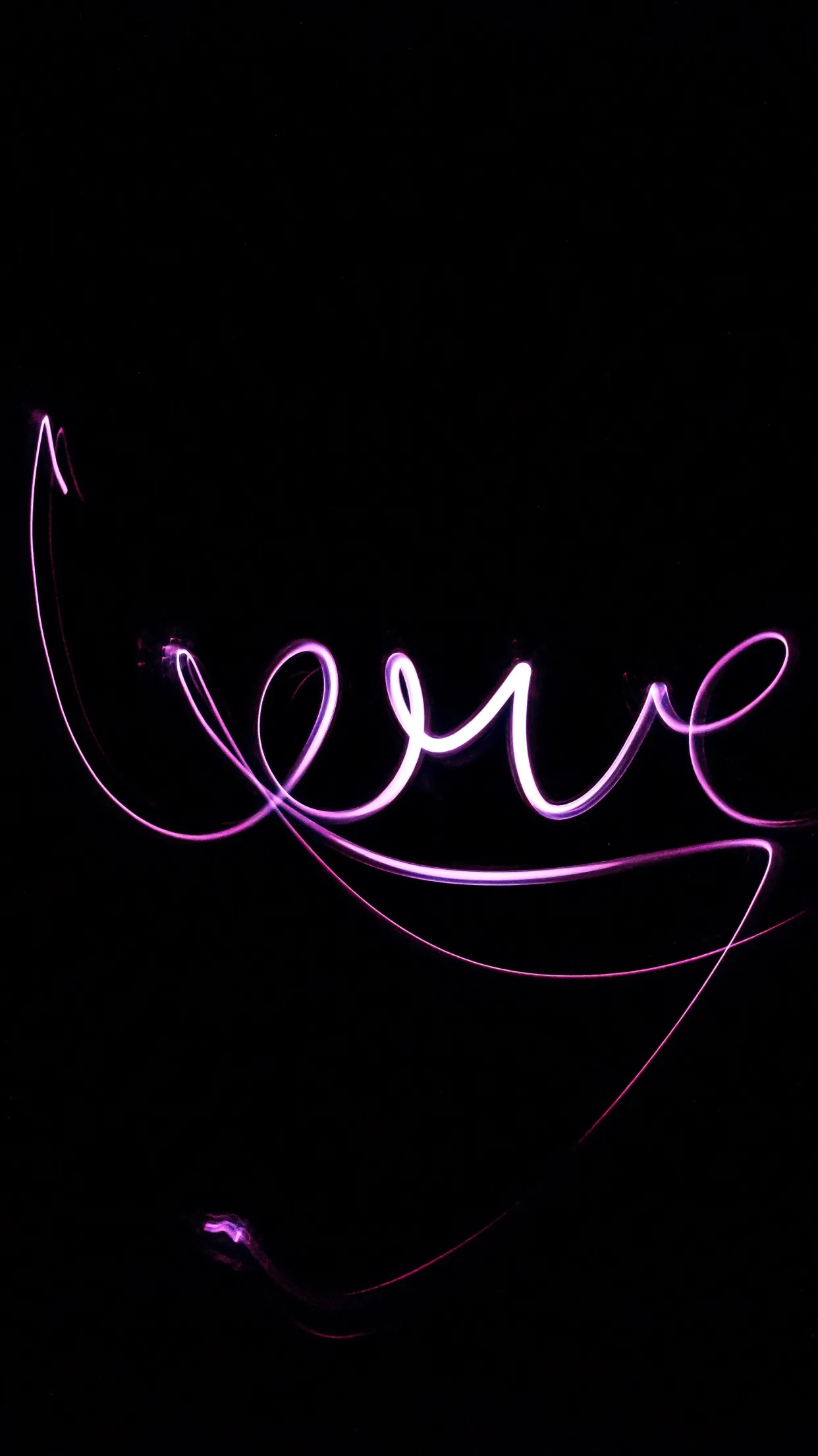 A single violet light trail loops through the word love and tails off toward the bottom of an otherwise black portrait frame.