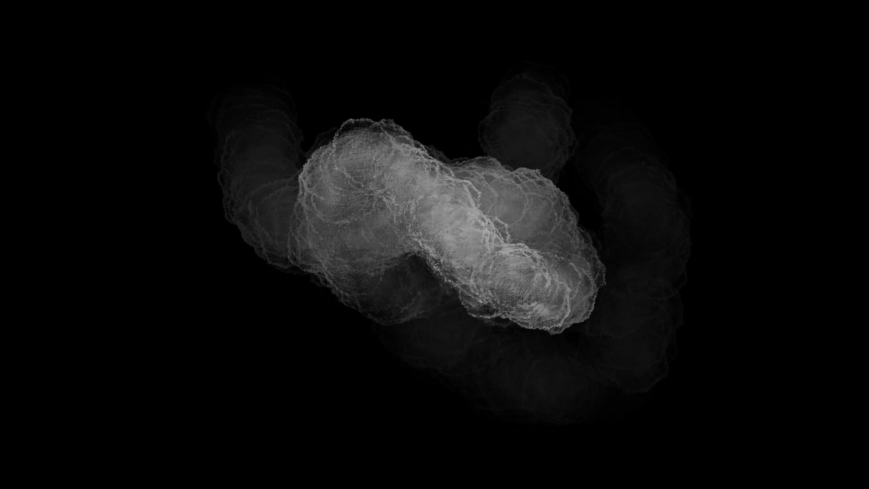 A single puff of pale smoke curls through the middle of the frame, its edges dissolving into black long before they reach the borders.