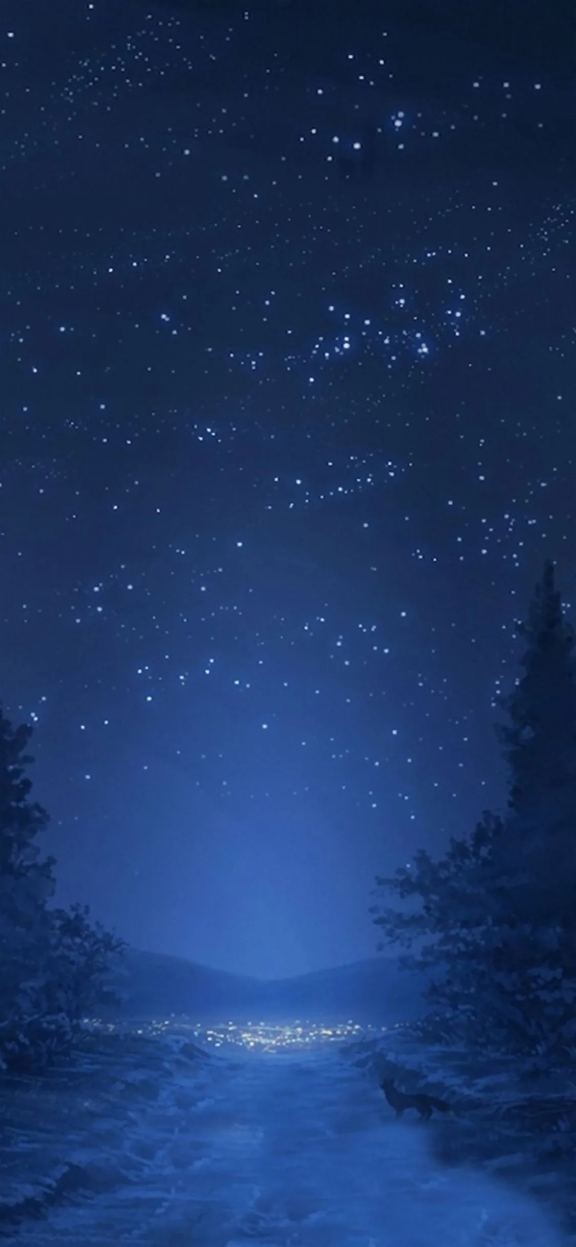 Winter pines frame a snowy valley under a deep blue star-filled sky, a thin line of village lights glowing along the valley floor.