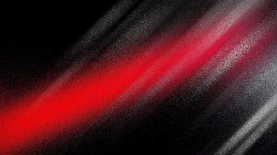 A red streak runs diagonally through heavy black grain, the grey light beside it soft enough to leave the corners almost empty.