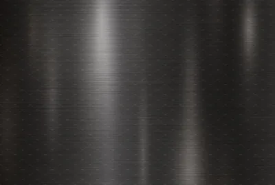 Vertical bands of reflected light sweep down brushed steel dotted with faint stud rows, the brightest strip sitting left of centre.