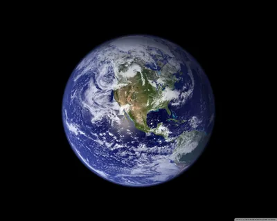 North America sits at the centre of the sunlit disc with thick cloud swirls over both oceans, even black space left on all four sides.