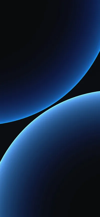 Two enormous spheres pass through the frame, each lit only along its curved rim in pale blue, the space between them completely black.