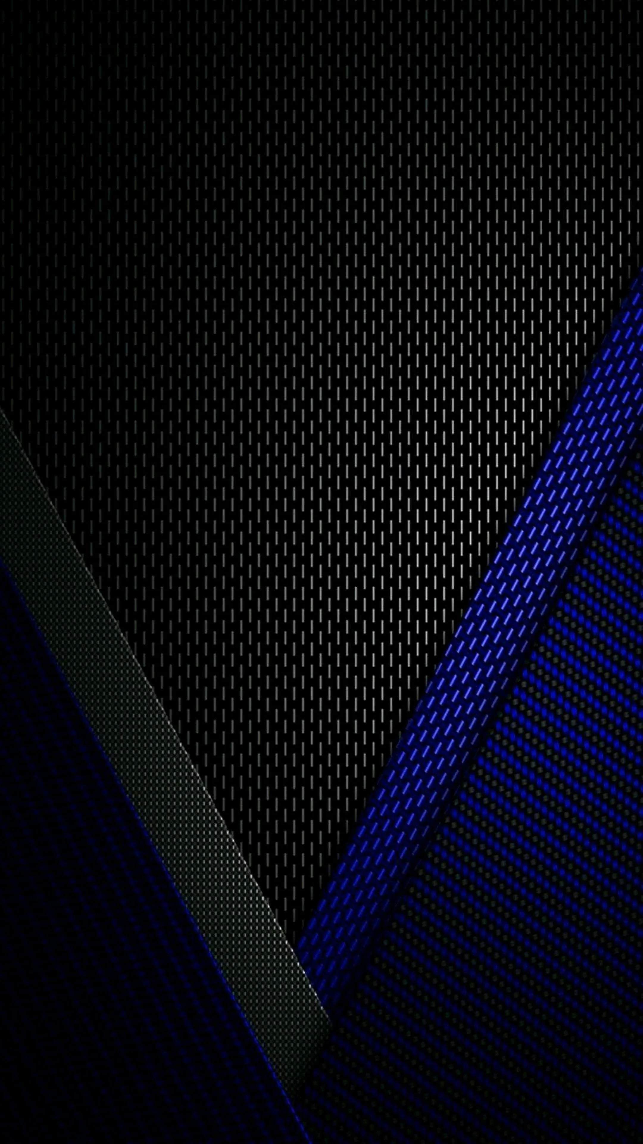 Perforated metal panels overlap down a tall dark frame, a blue lit section running along the right side from top to bottom.