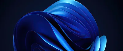 Stacked blue petals fold into a rounded form at the centre of a wide navy frame, each fold catching a different amount of light.