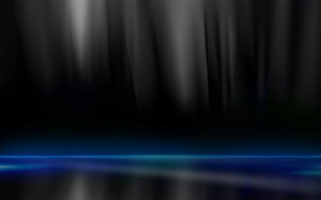 Blurred dark drapes hang above a reflective floor lit by a horizontal streak of blue, the top of the frame left in shadow.