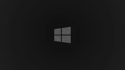 The four panes are filled with a fine woven mesh and sit slightly above centre on charcoal, the corners dropping away to near black.
