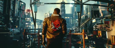 Seen from behind, a man in the bronze Samurai jacket walks a crowded market lane, the emblem on his back catching the only warm light.