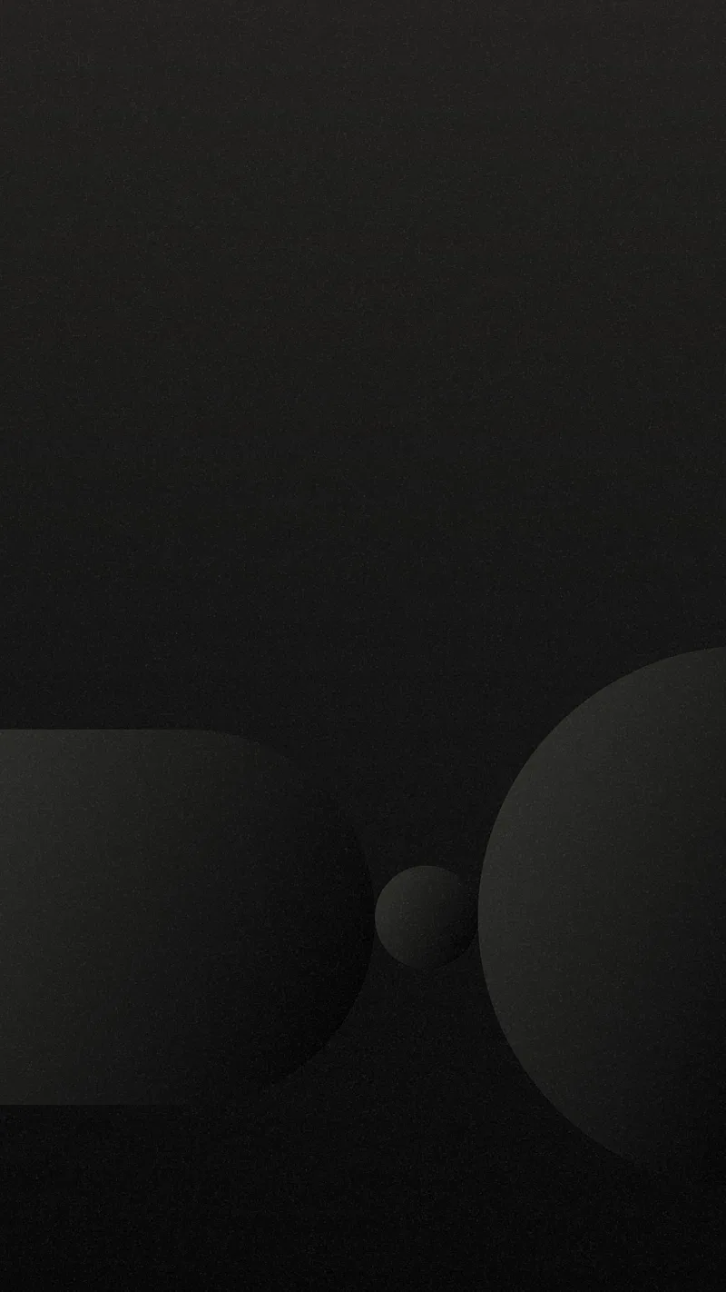 Two large rounded forms meet near the bottom of a charcoal gradient with a small ball resting in the gap between them.