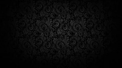 A raised damask scroll pattern repeats across the wall, brightest through the centre and sinking into a heavy vignette.