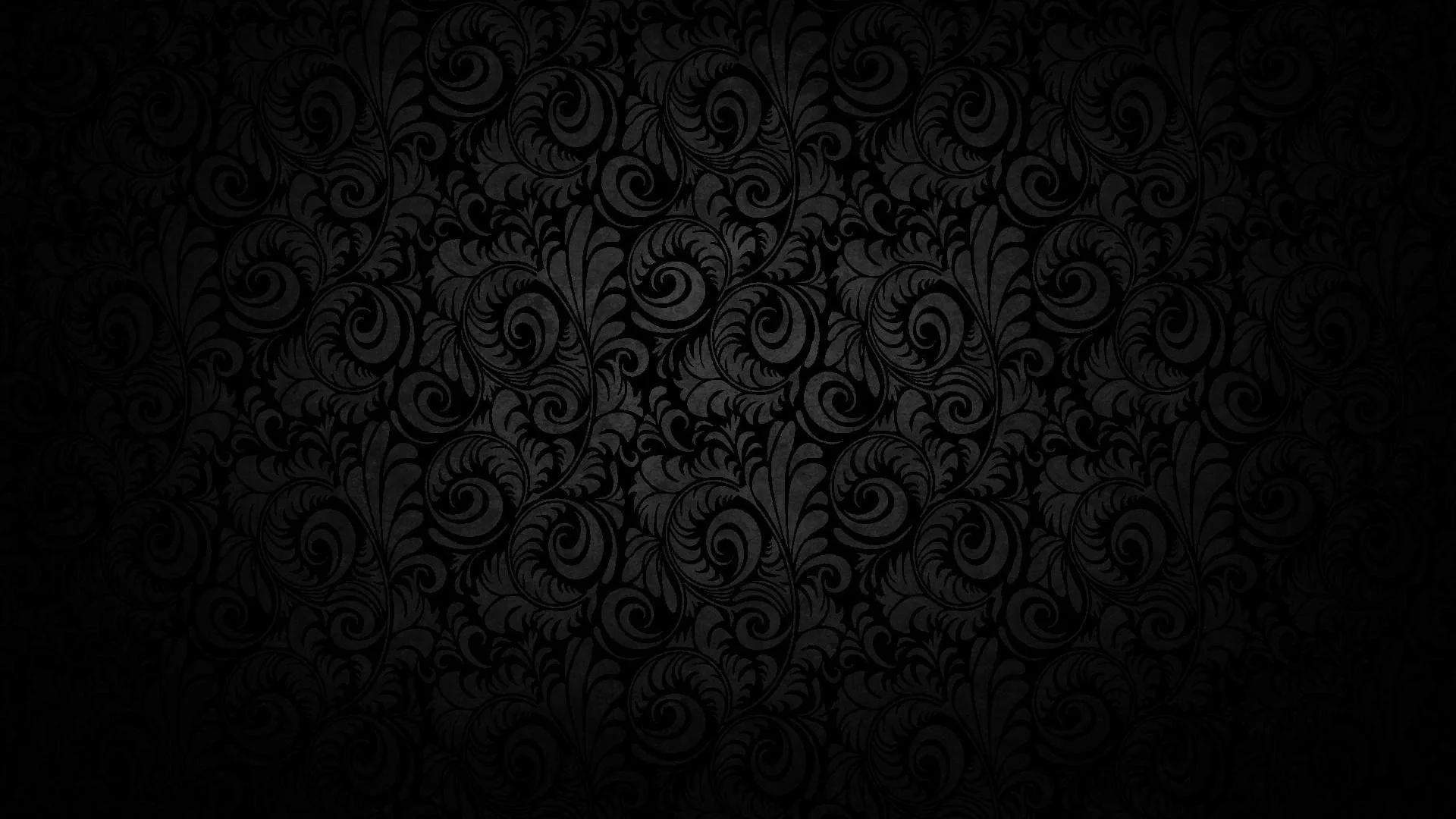 A raised damask scroll pattern repeats across the wall, brightest through the centre and sinking into a heavy vignette.