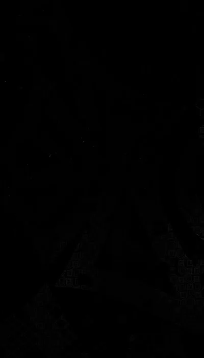 Almost the whole frame reads as solid black, with faint creased folds surfacing near the bottom where the light barely catches the cloth.