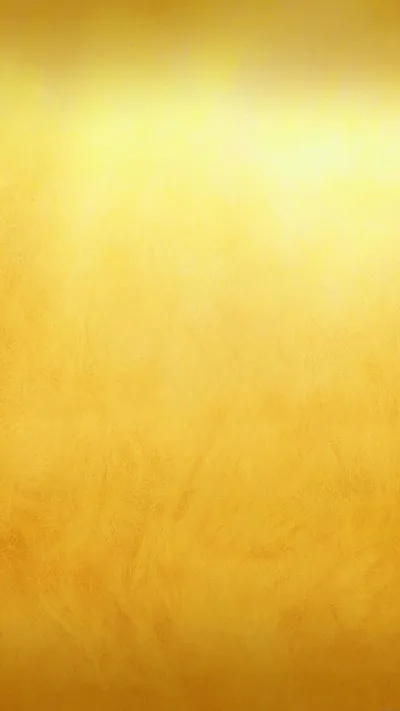 A soft mottled wash of amber like polished plaster, glowing faintly at the top and staying detail-free below so the clock and icons stay readable.
