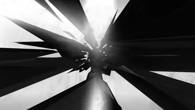 Angular black and white blades converge on a blown-out point at the centre, reflections running along their flat faces to pull the eye inward.