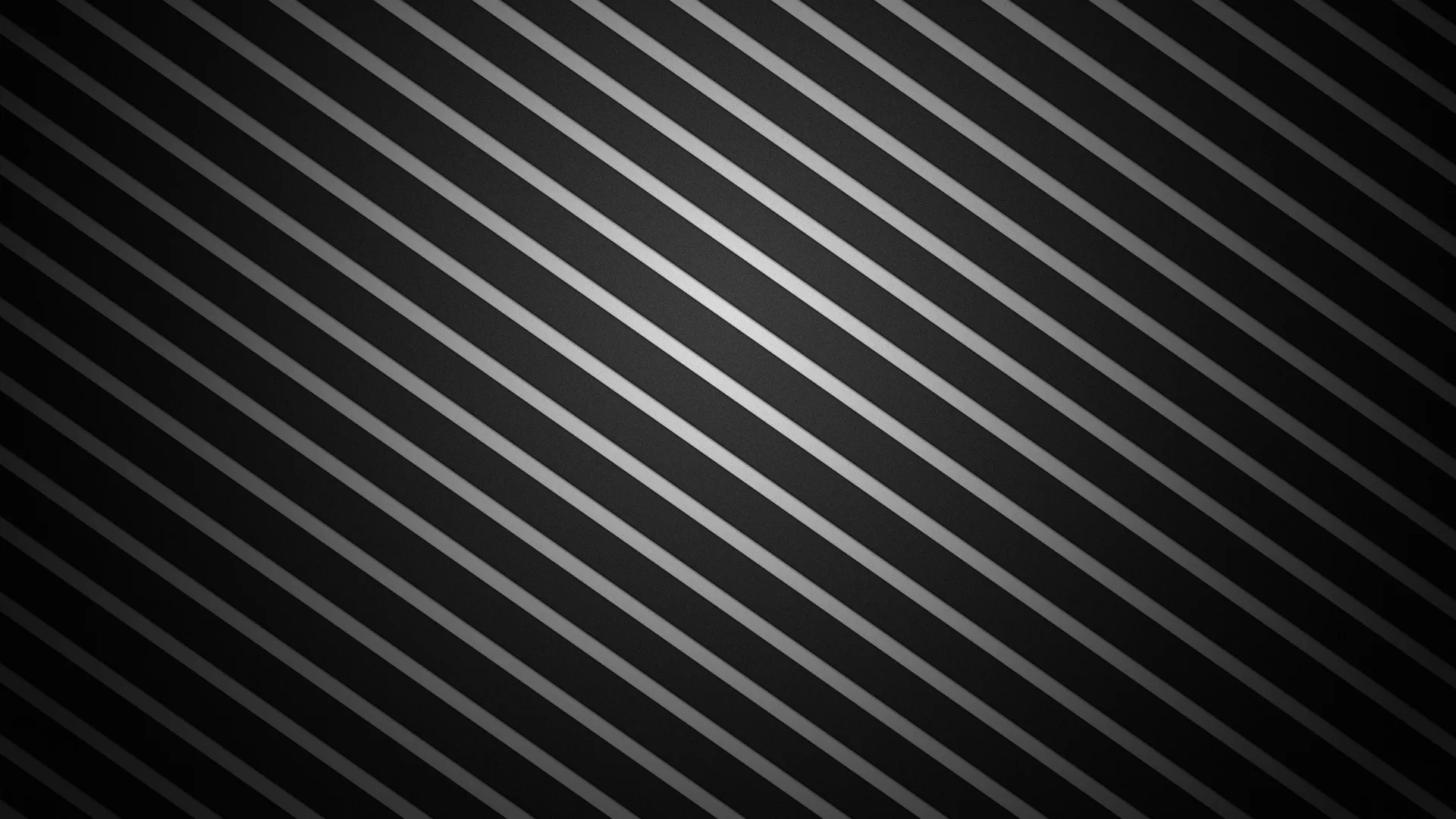 Ribbed dark metal runs diagonally across the frame, each ridge holding a narrow highlight.