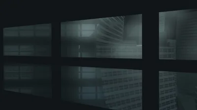 Three tall panes of grey-green glass look onto an unlit stairwell, the whole row mirrored again in the polished floor below.