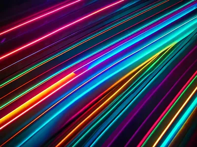 Close-up of light strips running corner to corner, the colour shifting from magenta through blue to green along each one, with black seams between.