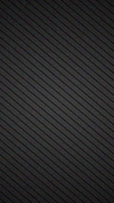Fine diagonal ridges run corner to corner in charcoal grey, an even repeating weave with no bright spot anywhere in the frame.