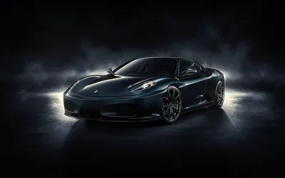 Thin smoke drifts across a dark studio floor around a black F430, side lights raking the sills and leaving the roof and windscreen almost unlit.