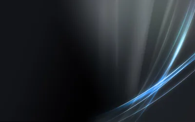 Thin blue and silver streaks sweep up from the bottom right, the rest of the frame left in soft shadow.